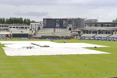 Ground staff at Edgbaston prepare to remove the covers. Picture: BARRY GOODWIN