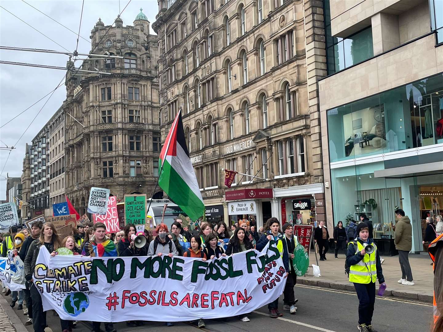 Climate protesters marched down Princes Street (Lauren Gilmour/PA)