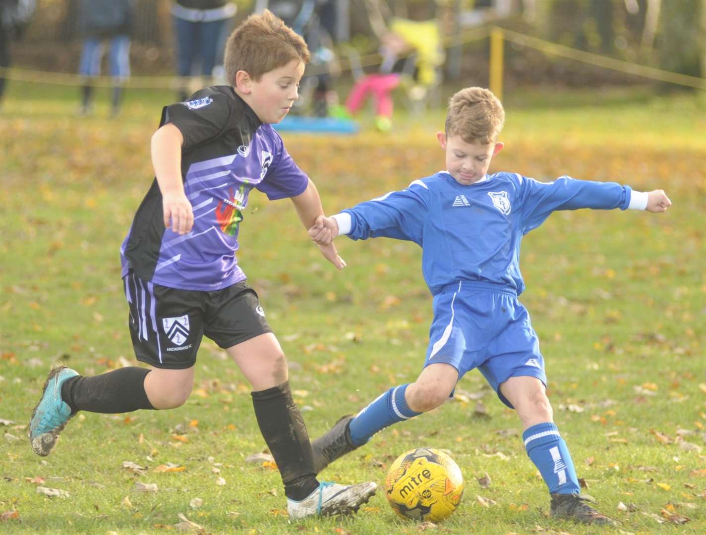 Anchorians Lions (left) and New Road under-10s battle it out Picture: Steve Crispe