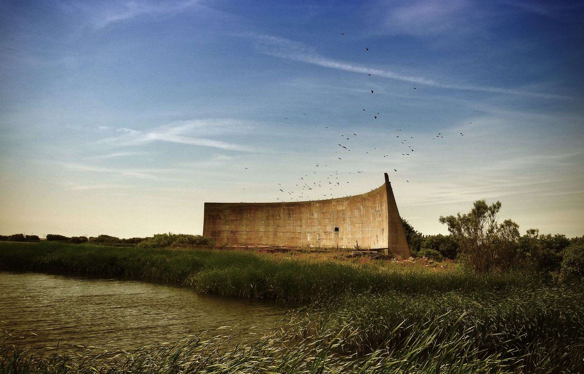 These large sound mirrors at Denge Marsh, near to Dungeness, were an experimental idea in the early 1930s, to capture the sound of possible enemy aircraft flying over the English Channel and attacking mainland Briton. They were designed to act as giant sound ears, and were placed along various sections of the Kent and Sussex coastline. They were never used in action, because shortly after construction, radar was invented!