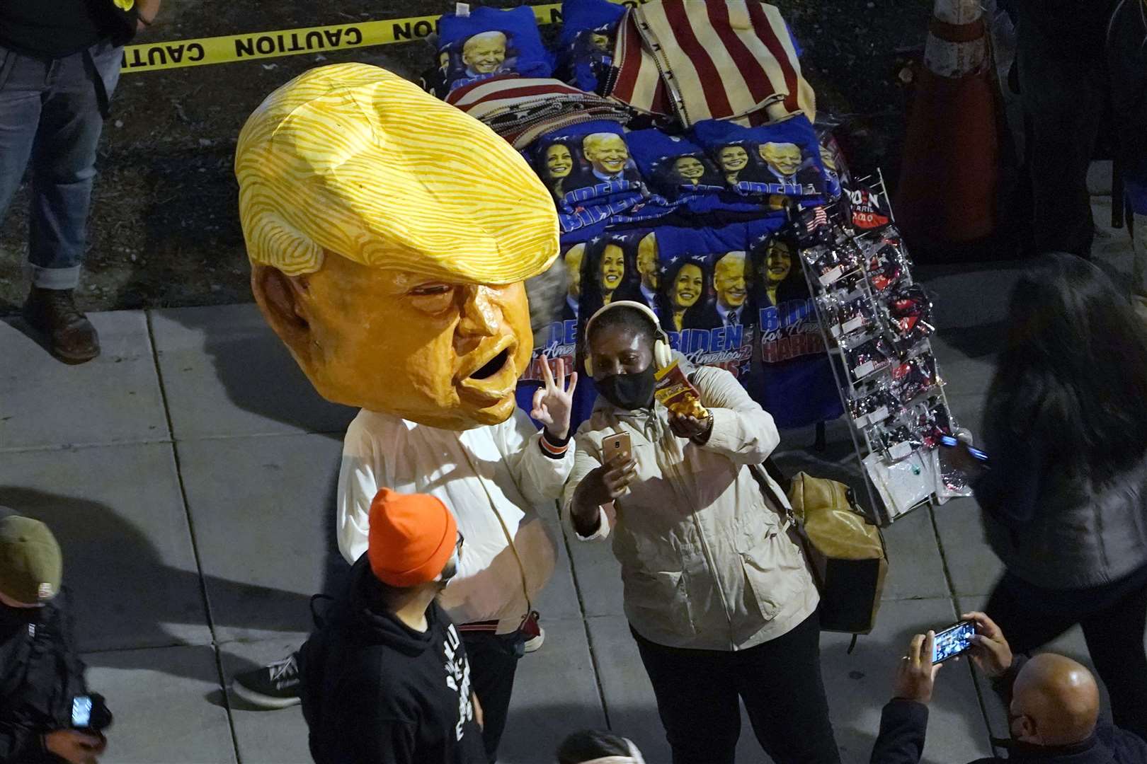 A person in a Donald Trump costume joins protesters in Black Lives Matter Plaza, Washington (Susan Walsh/AP)