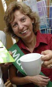 Shaun O'Reilly and Eniko Benfield enjoy a cuppa at a Macmillan Cancer Support coffee morning