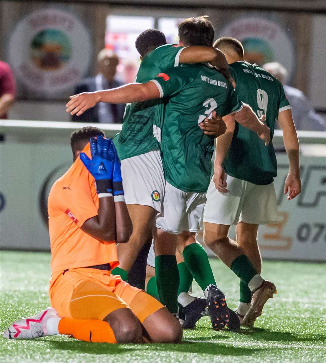 Ashford celebrate their injury-time winner against Sevenoaks after Tom Carlse’s run and shot goes in off defender Jahmal Howlett-Mundle for an own goal. Picture: Ian Scammell