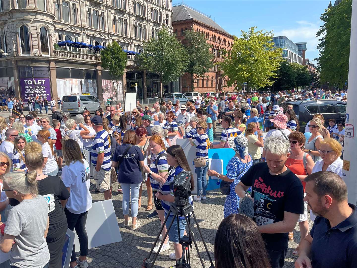 Protesters opposing the PII application outside Belfast City Hall in August (PA)