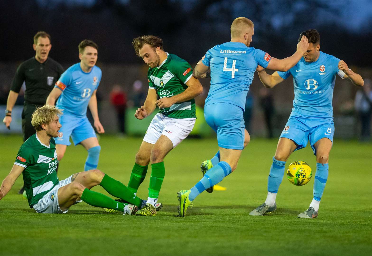 Ashford midfielder Tommie Fagg on the deck in the 2-1 defeat by Hastings, as Luke Burdon looks on Picture: Ian Scammell