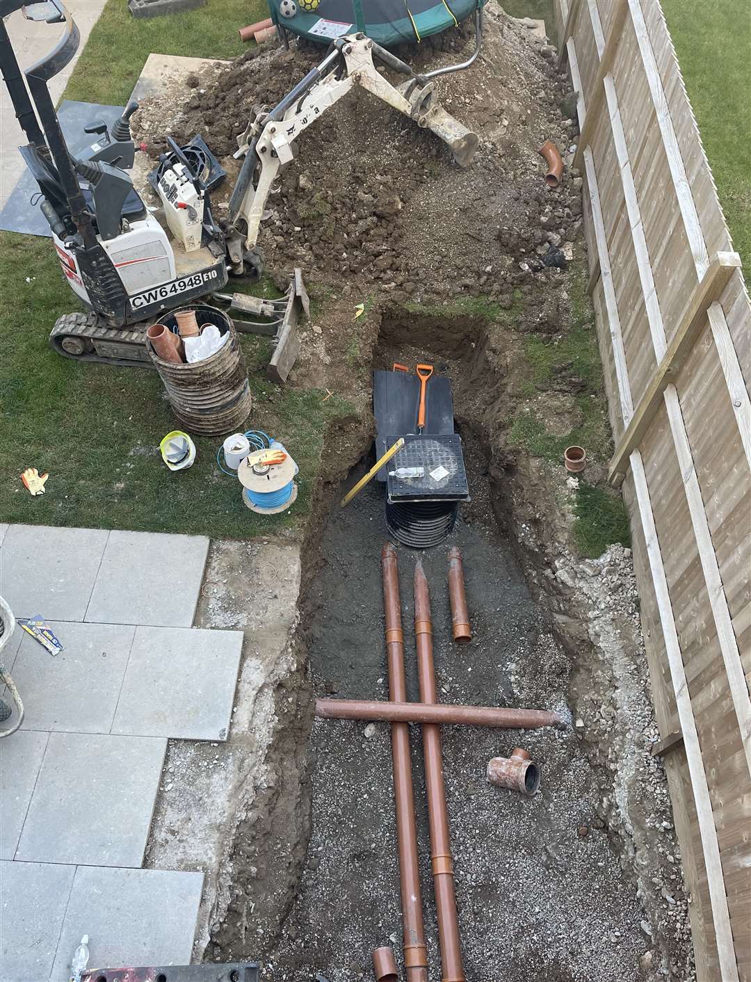 Gardens and patios have been completely dug up for drainage repairs on the new-build homes