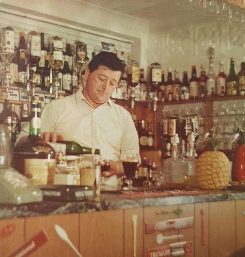 Clarence West pouring a drink back in the 1970s