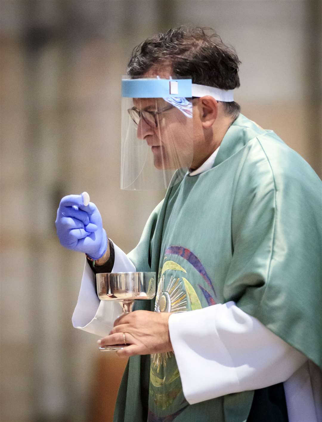 The Dean of York, the Right Revd Dr Jonathan Frost leads the first public Holy Communion to be held at York Minster since the easing of coronavirus lockdown restrictions across England (Danny Lawson/PA)