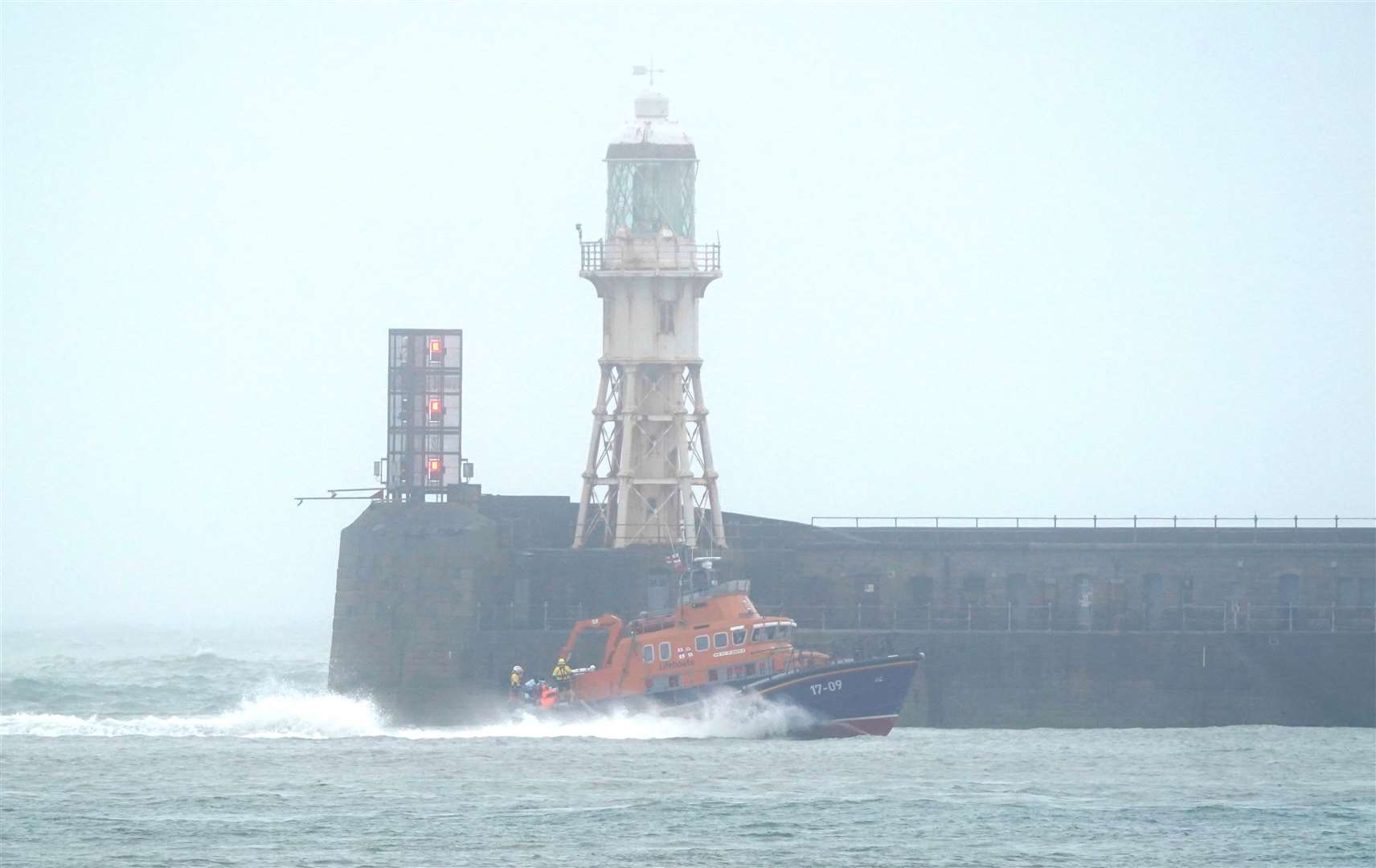 A group of people thought to be migrants are brought in to Dover (Gareth Fuller/PA)