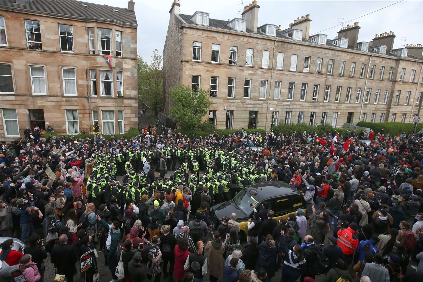 Hundreds of people joined the protest against the men’s removal (Andrew Milligan/PA)