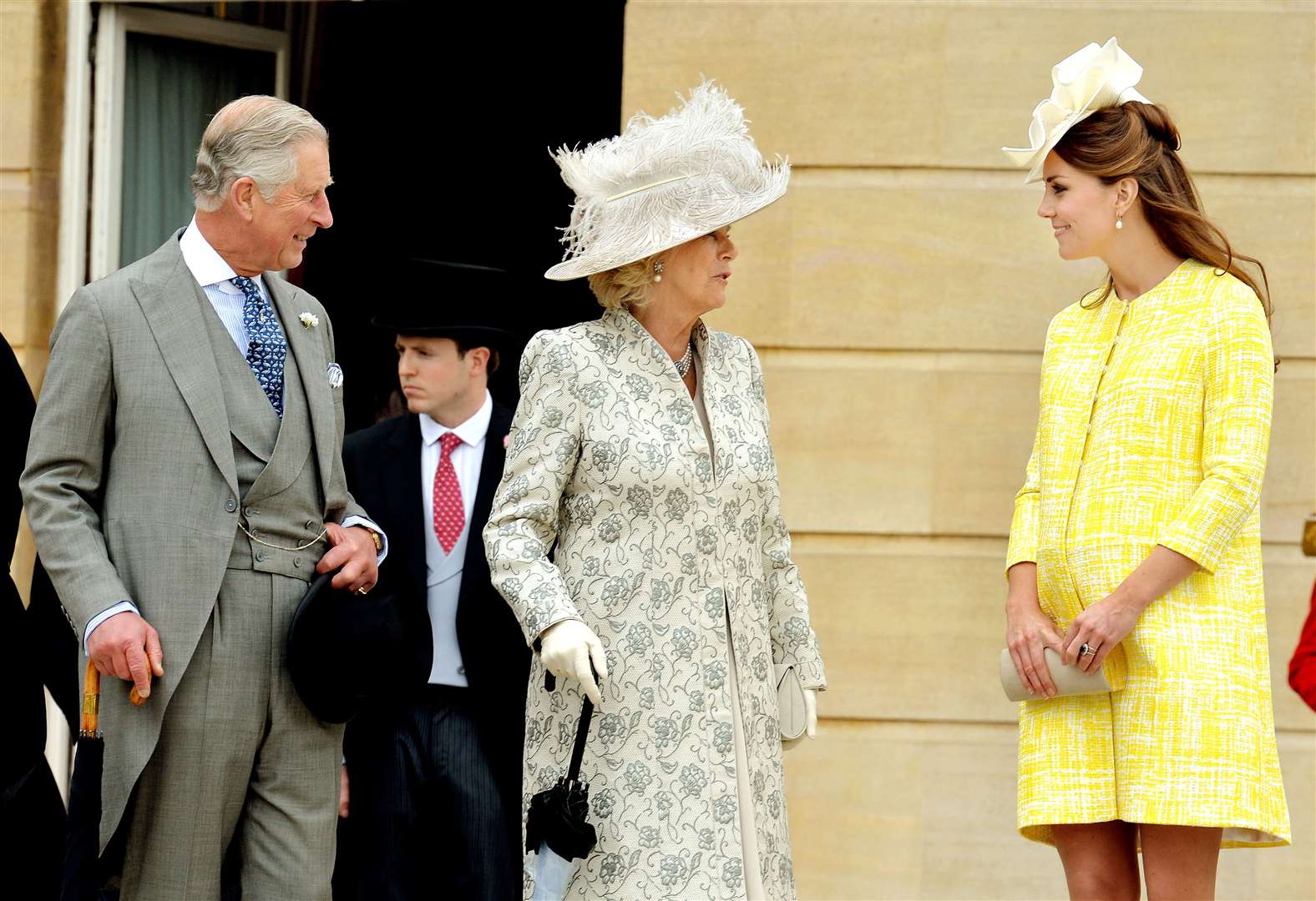 The then-Prince of Wales and Duchess of Cornwall with Kate at a garden party at Buckingham Palace in 2013 (John Stillwell/PA)