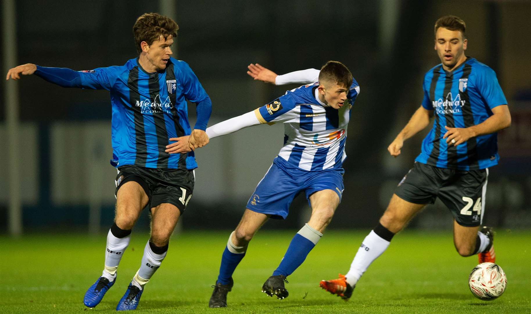 Gillingham's Billy Bingham gets to grips with Tyrone O’Neill. Picture: Ady Kerry