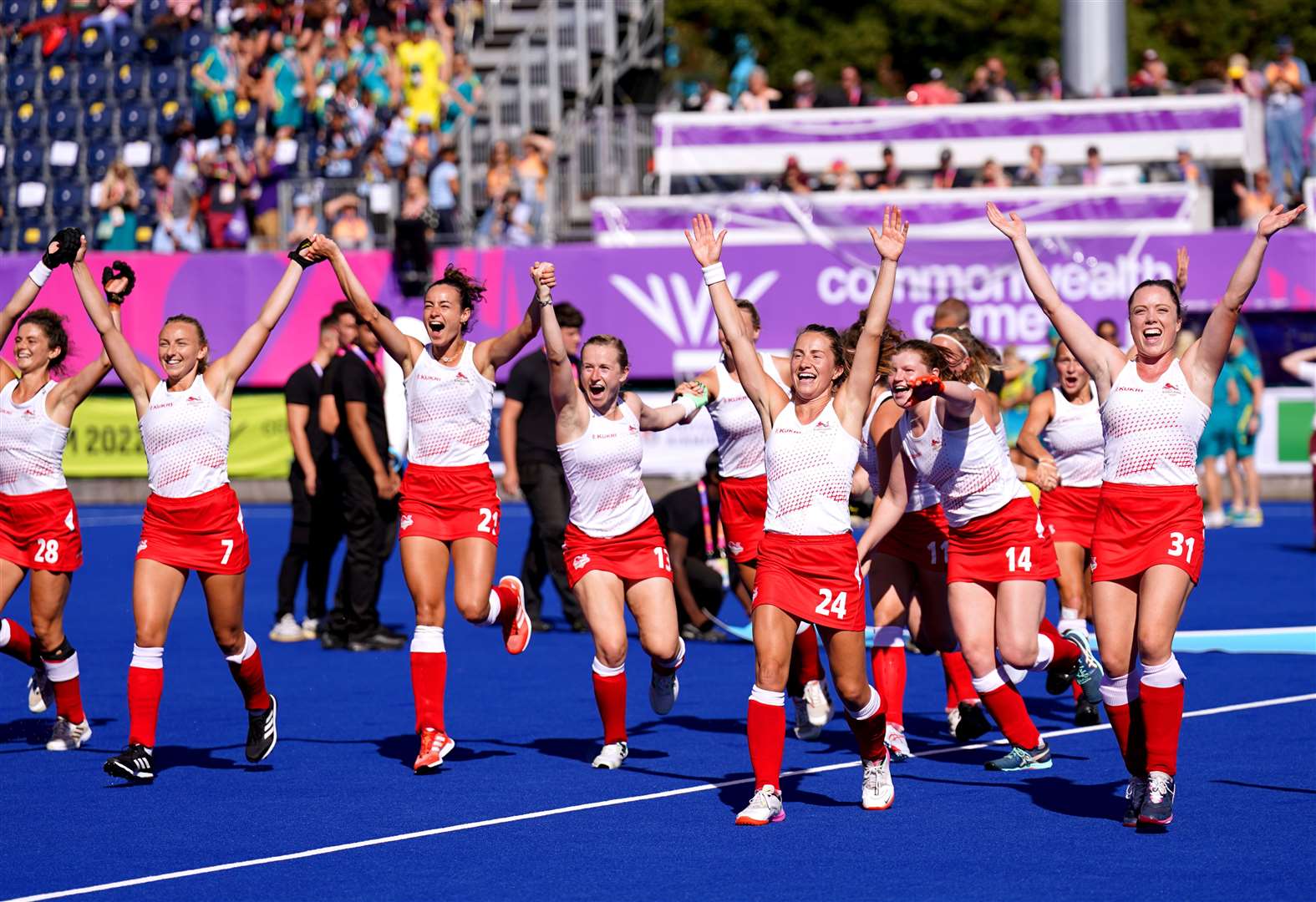 The England women’s hockey team celebrate after winning their gold medal match against Australia (Joe Giddens/PA)