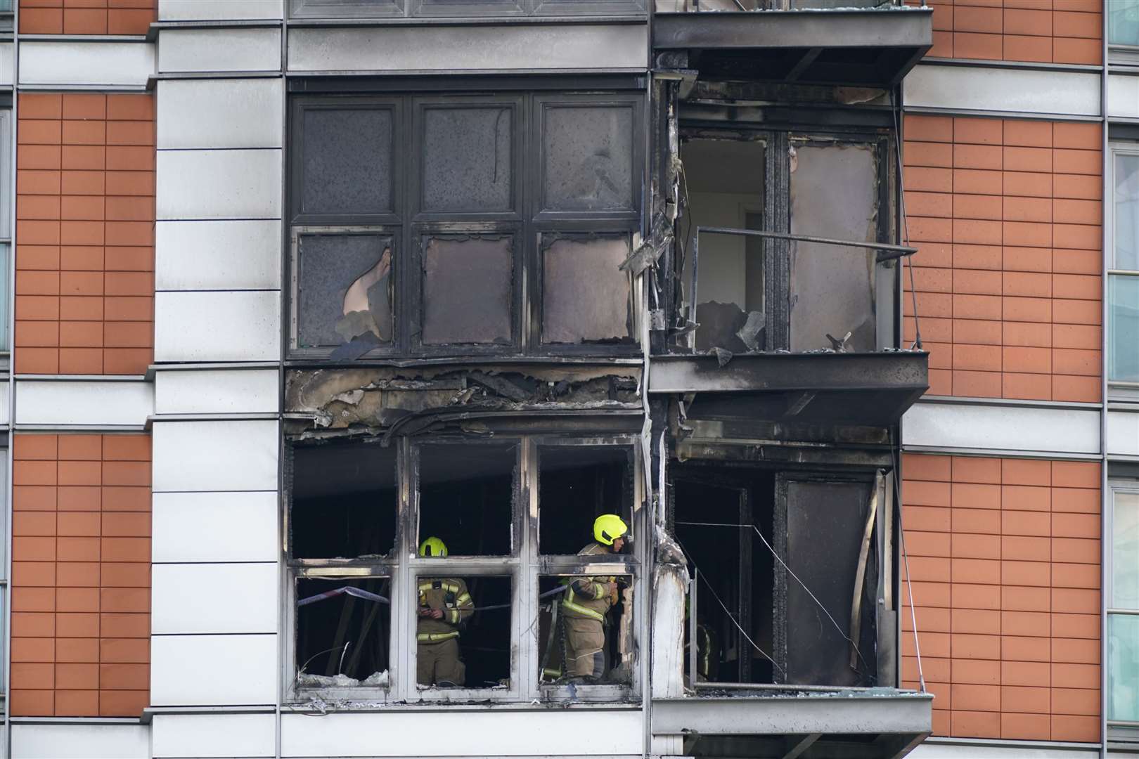 Firefighters inspect damage (Yui Mok/PA)