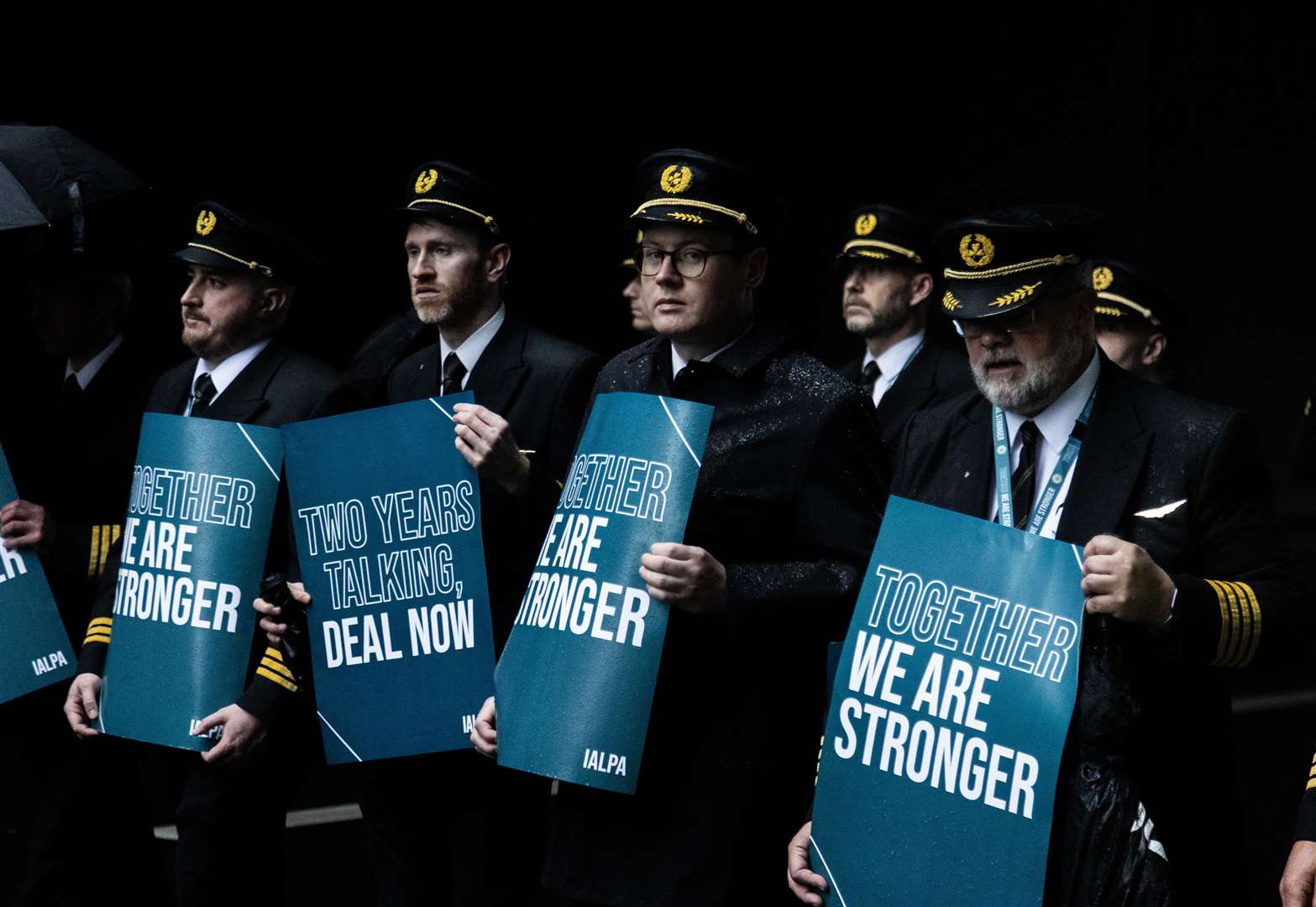 Aer Lingus pilots carry placards as they begin their strike (Evan Treacy/PA)