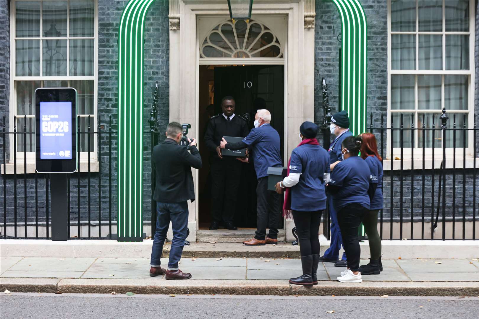 Members of the Royal College of Nursing handed the petition in to 10 Downing Street (James Manning/PA)