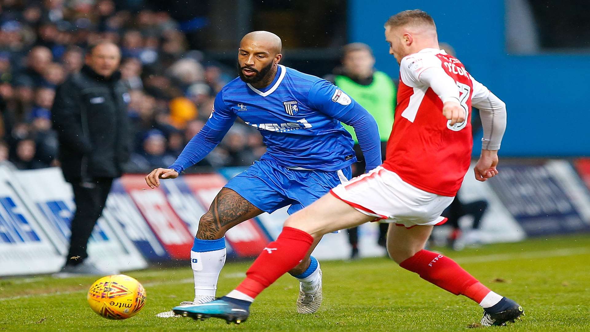 Gills striker Josh Parker takes on his man Picture: Andy Jones