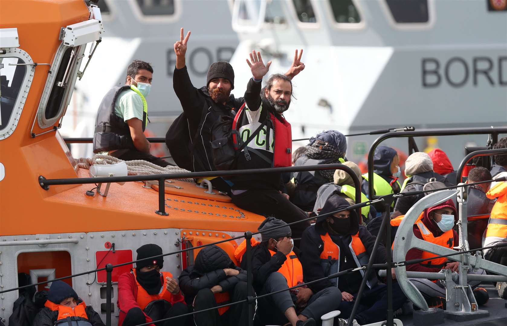 A group of people thought to be migrants are brought into Dover by the RNLI (Andrew Matthews/PA)