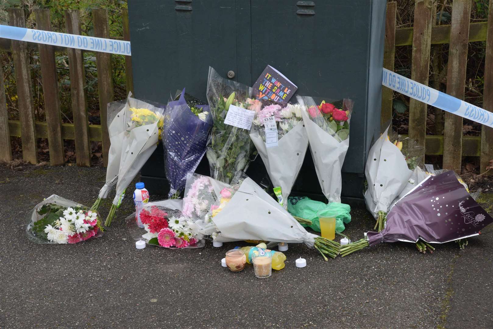 Floral tributes at the scene in Brookfield Road. Picture: Chris Davey
