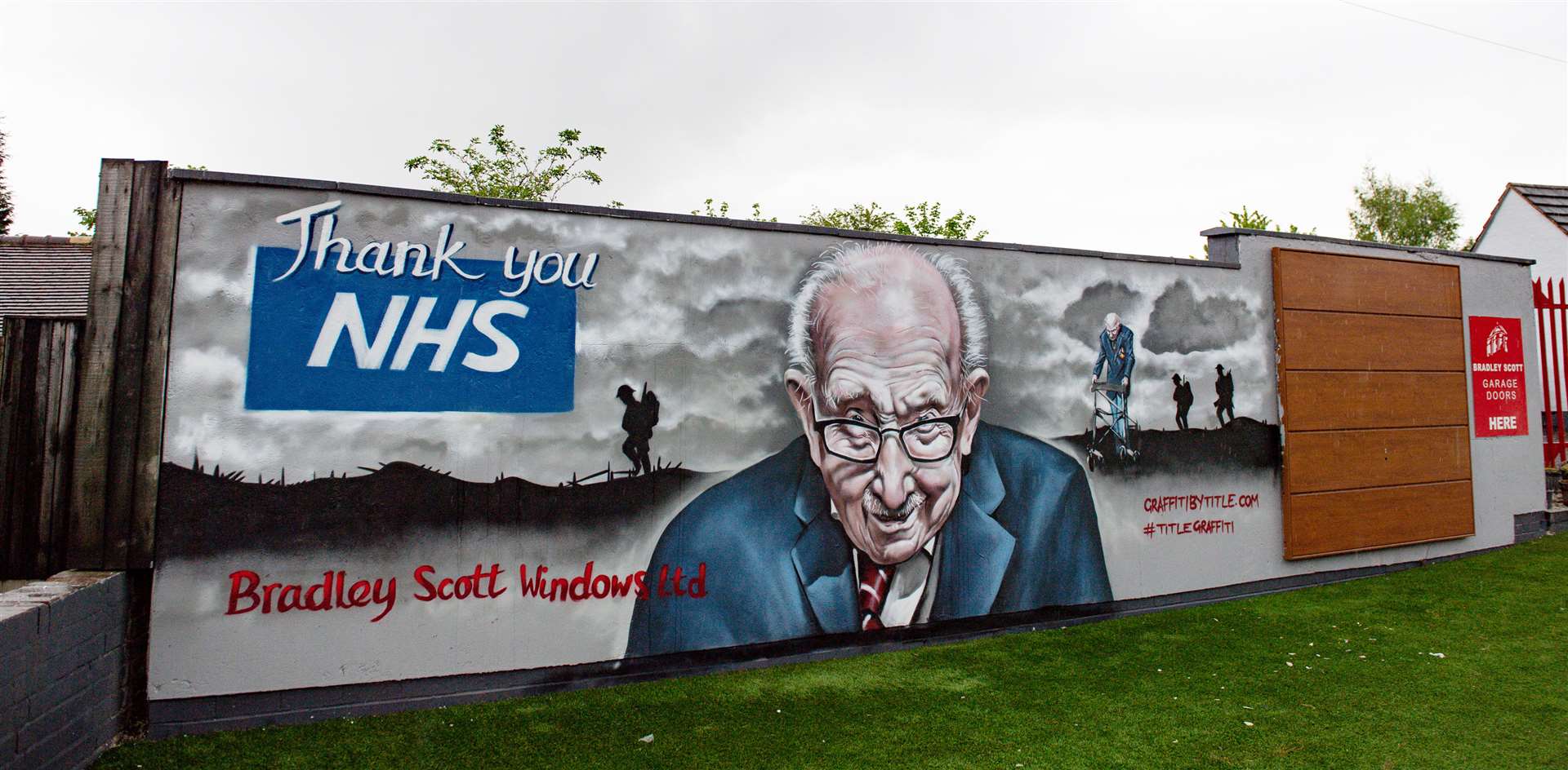 A mural paying tribute to NHS fundraiser Captain Tom Moore outside Bradley Scott Windows in Tamworth, Staffordshire (Jacob King/PA)