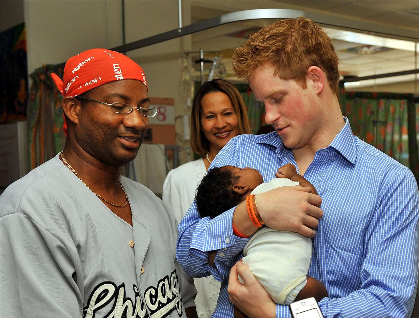 The Duke of Sussex has made a number of official visits to Barbados over the years and is pictured in 2010 holding Jean-Luc Jordan, aged seven weeks, with father Michael, left, at the Queen Elizabeth II Hospital in the capital Bridgetown (Arthur Edwards/PA)