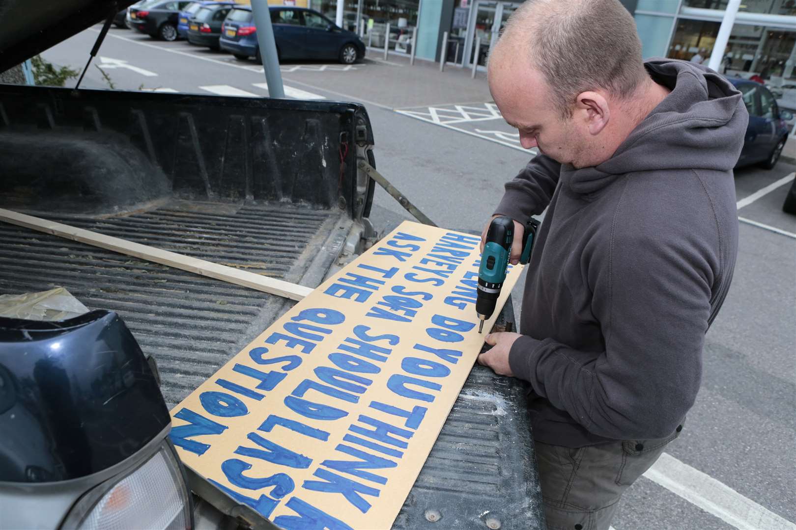 Ian Hayden, from Paddock Wood, staged a protest outside Harveys in Aylesford retail park. Picture by Martin Apps.