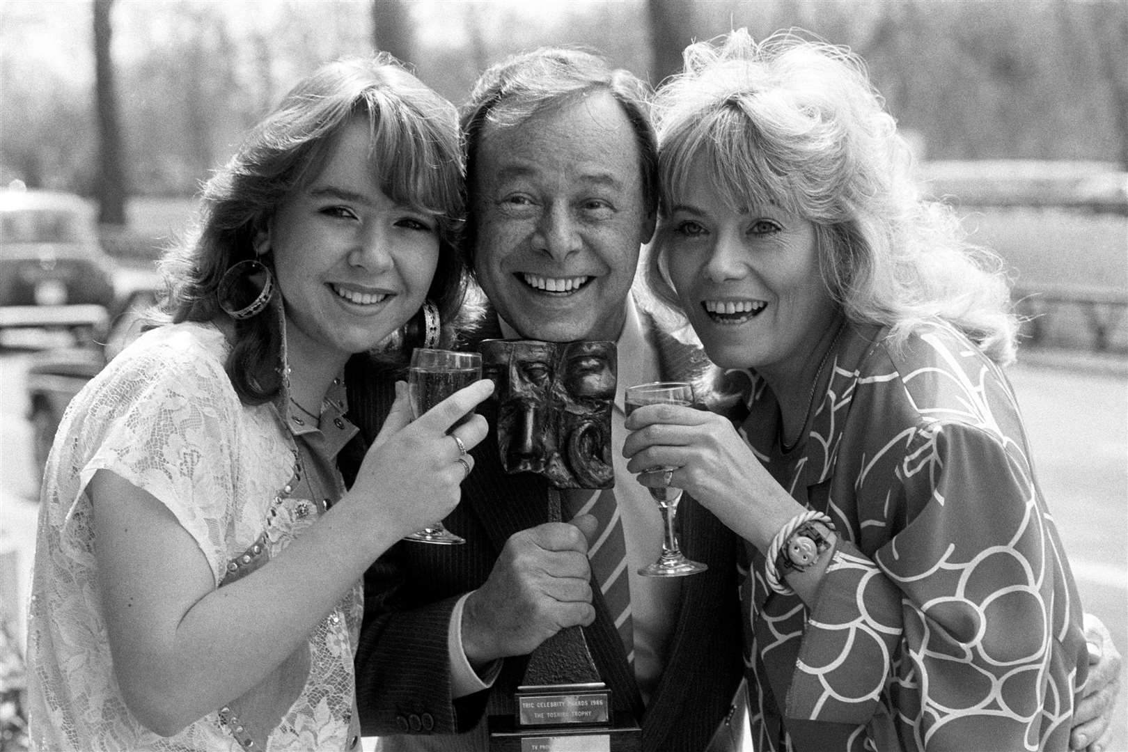 Bill Treacher with members of his EastEnders family Wendy Richard, who played Pauline, and Susan, who played their daughter Michelle (PA)