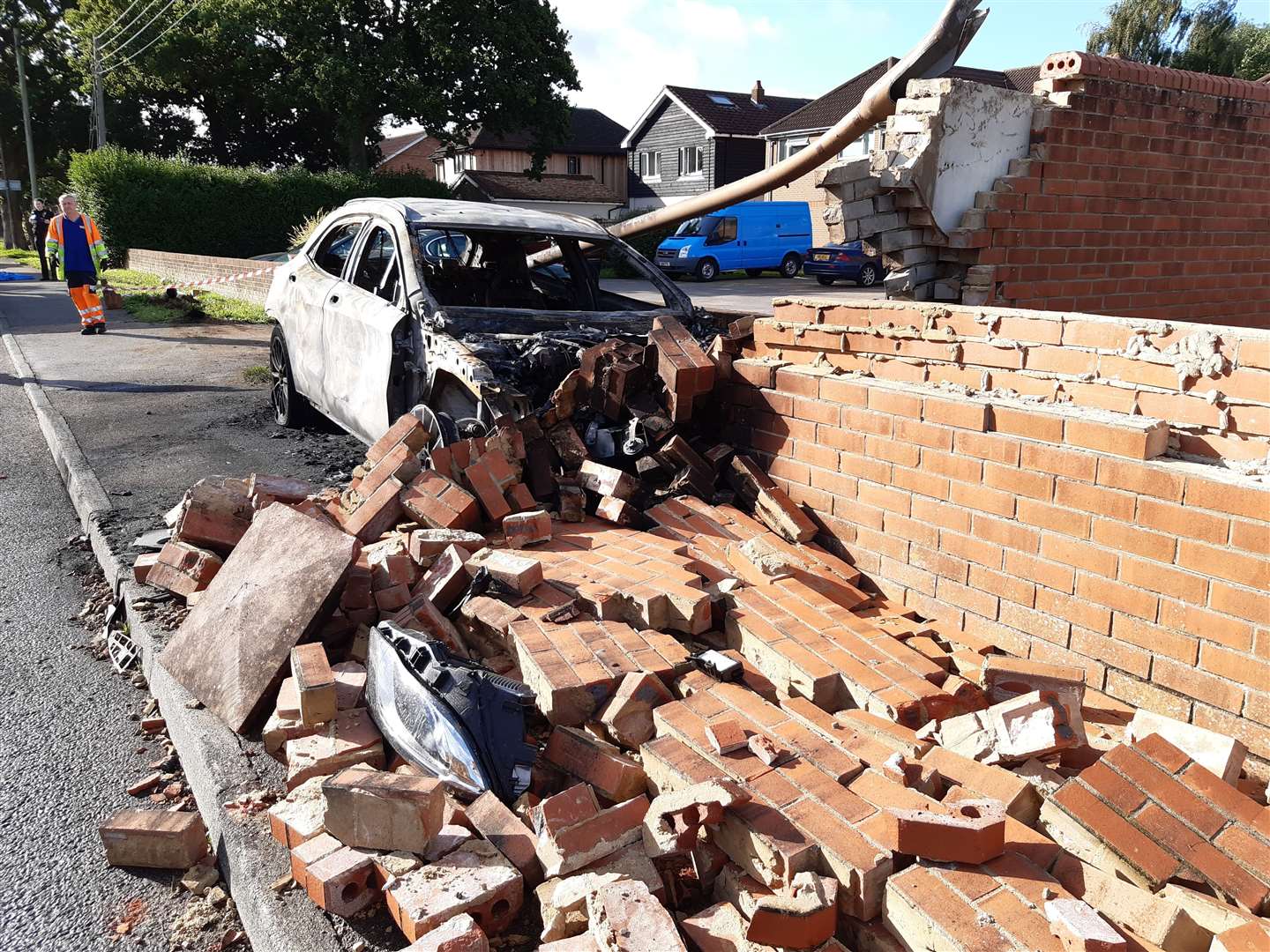 The destroyed car and wall in West Kingsdown