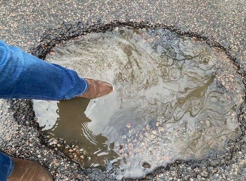 The depth of a pothole near Hythe that was hit by at least five drivers is demonstrated