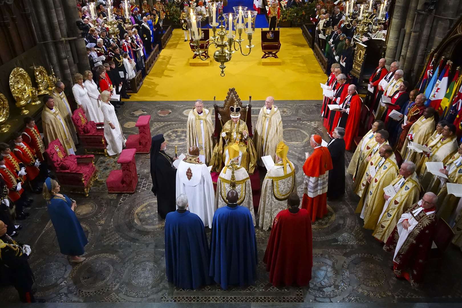 Charles, surrounded by faith leaders while in the Coronation Chair, during his coronation ceremony (Aaron Chown/PA)