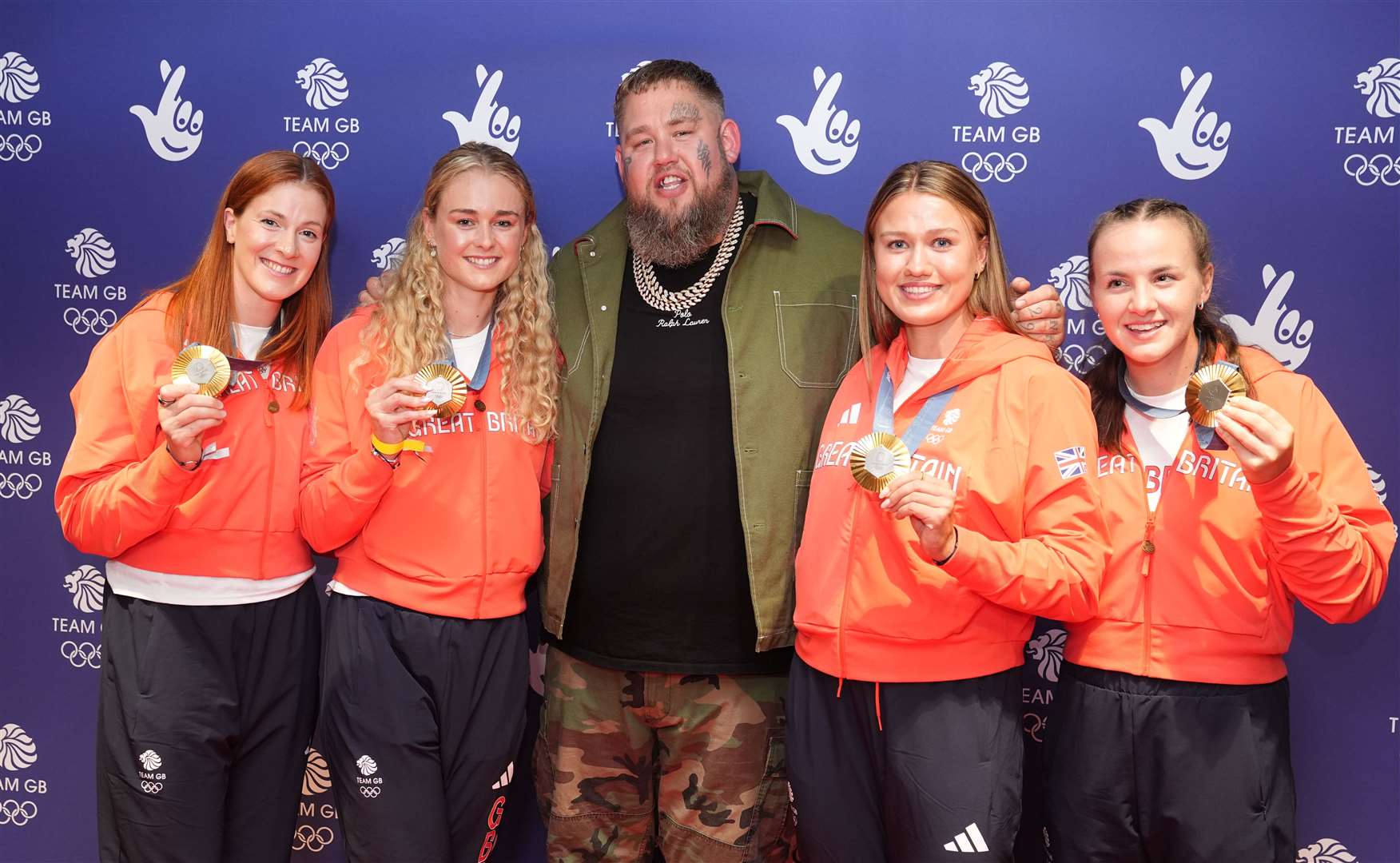 Rag’n’Bone Man (centre) with Georgina Brayshaw, Hannah Scott, Lola Anderson and Lauren Henry at the Team GB Homecoming (Martin Rickett/PA)