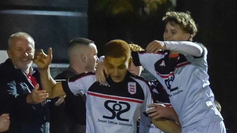 Hat-trick hero Tashi-Jay Kwayie, left, celebrates with Nathan Wood. Picture: Ian Scammell.