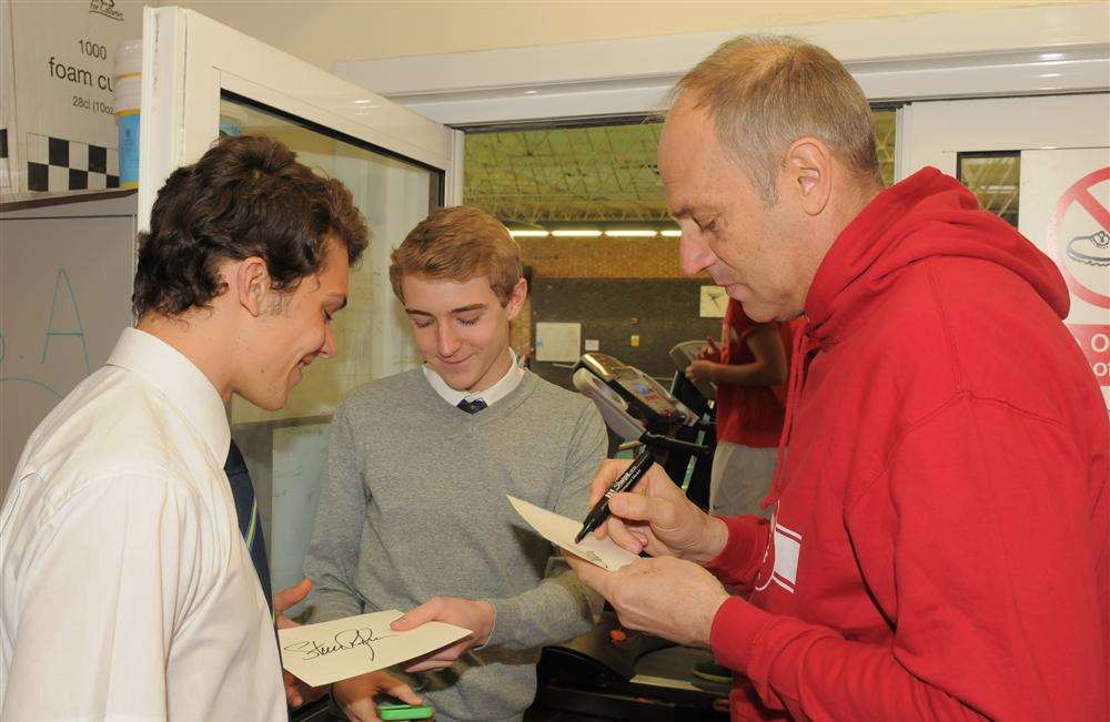 Sir Steve signs autographs for pupils