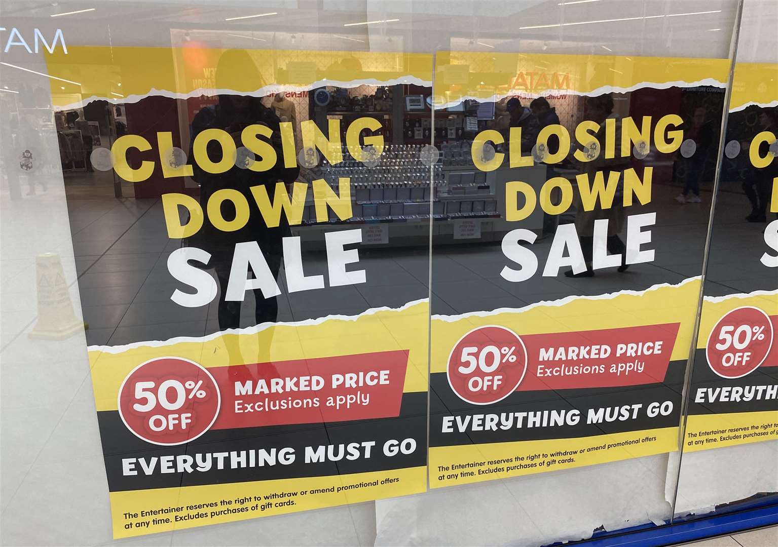 Signs posted on the front of the store
