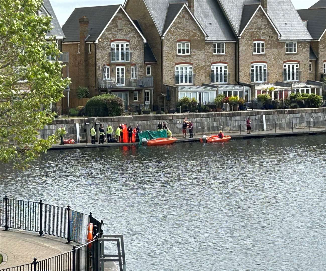 Police and other emergency services on the quayside path on St Mary's Island in Chatham. Picture: Brad Harper
