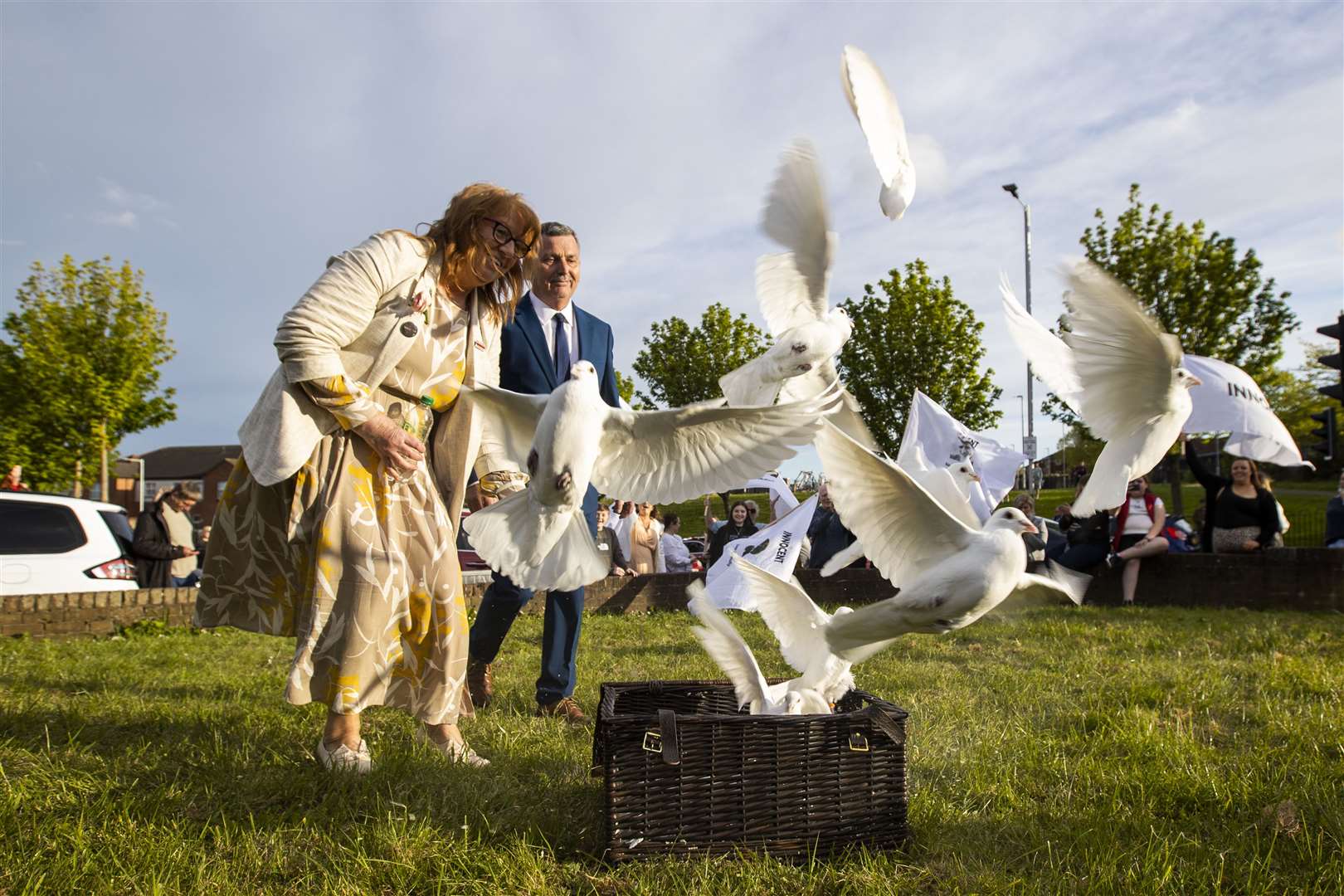 Briege Voyle, daughter of victim Joan Connolly, releases doves in the Ballymurphy area (Liam McBurney/PA)