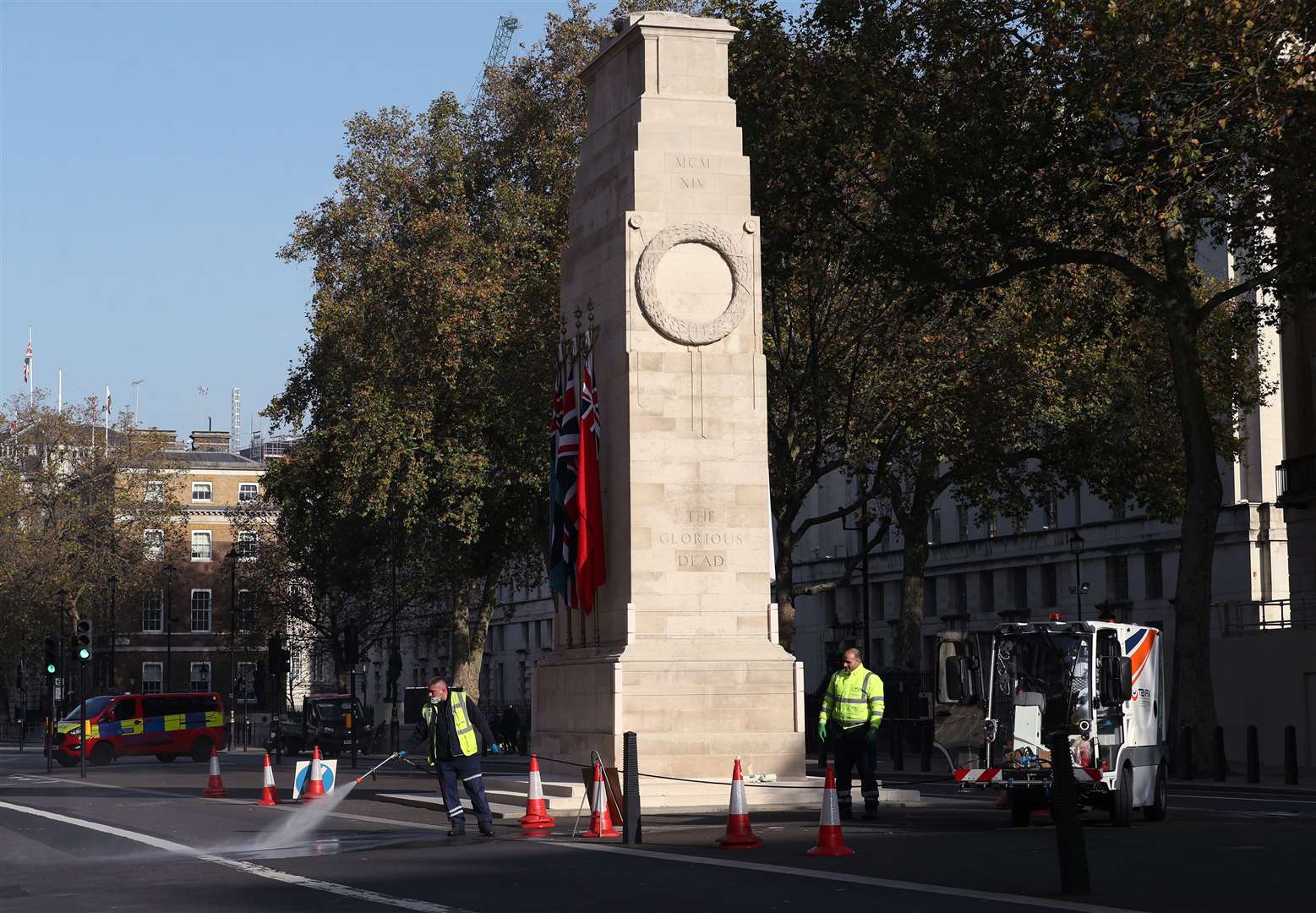 Cleaners at the Cenotaph on Whitehall in Westminster ahead of Remembrance Sunday (Yui Mok/PA)