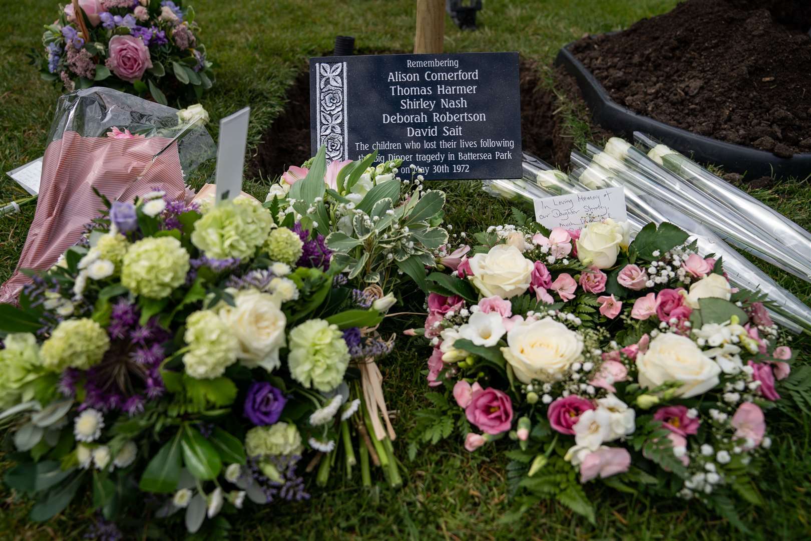 Floral tributes to those who died in the the disaster (Aaron Chown/PA)