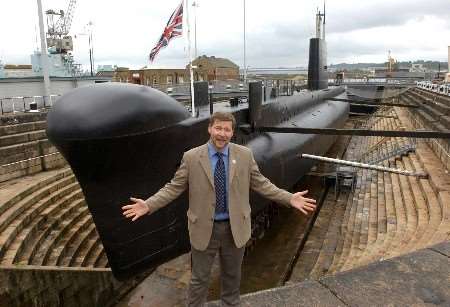Walking Bus Kent Project chairman Simon Dolby by HMS Ocelot at Chatham's Historic Dockyard. Picture: JIM RANTELL