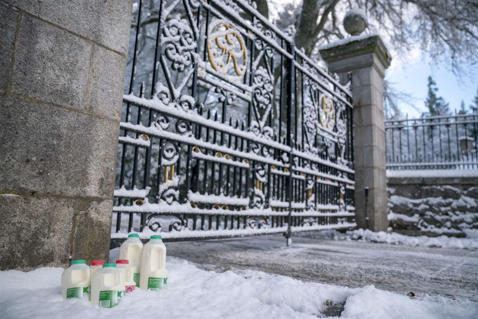 Milk is left in the snow at the entrance to Balmoral Castle (Jane Barlow/PA)