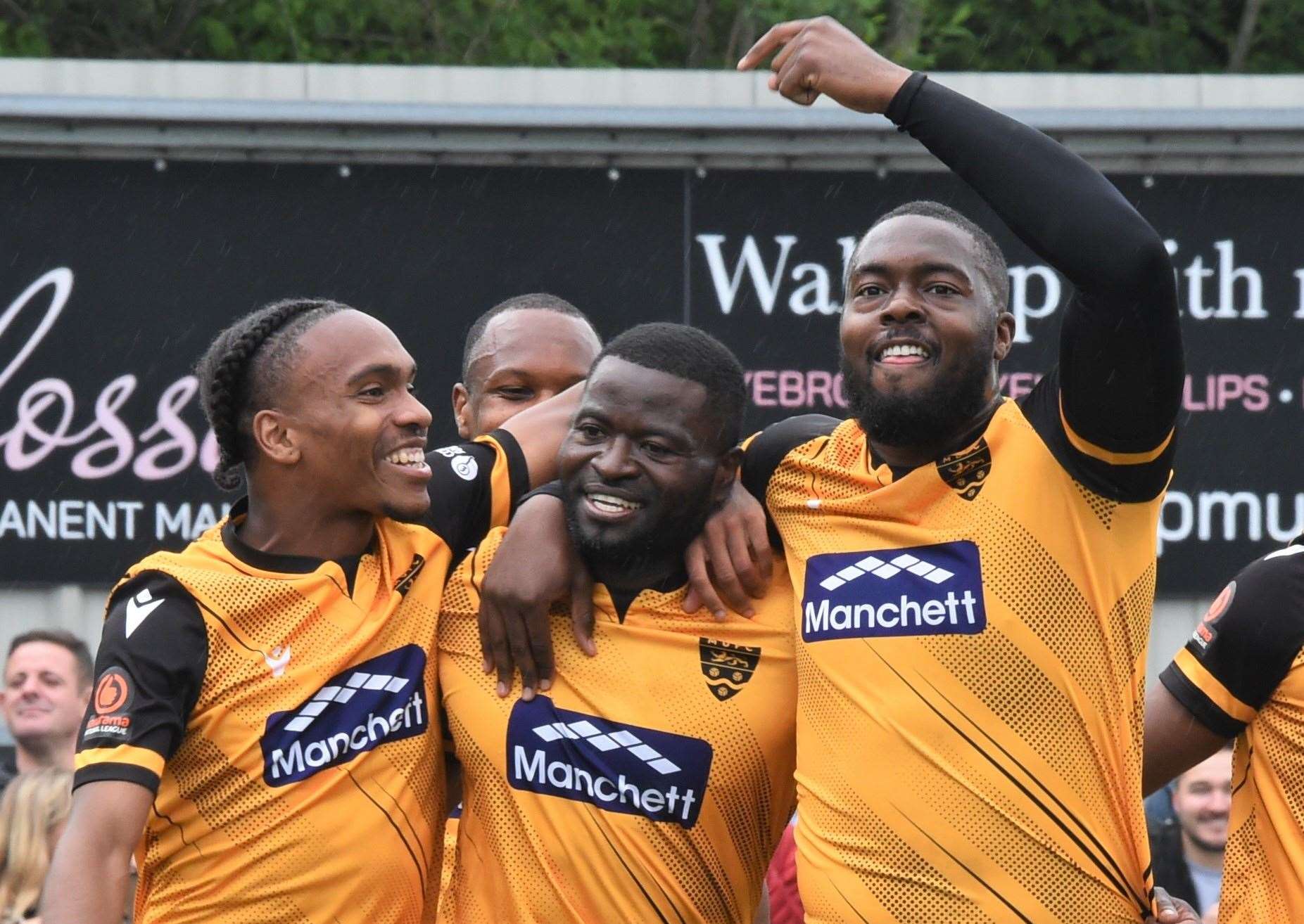 George Elokobi, centre, celebrates scoring in his final game before retirement Picture: Steve Terrell