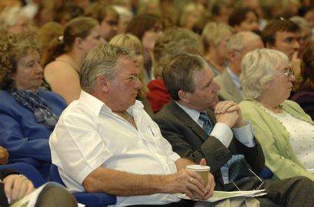 Public Meeting on health plans and the controversial move of maternity and childrens inpatient services away from Maidstone Hospital. The audience listen.