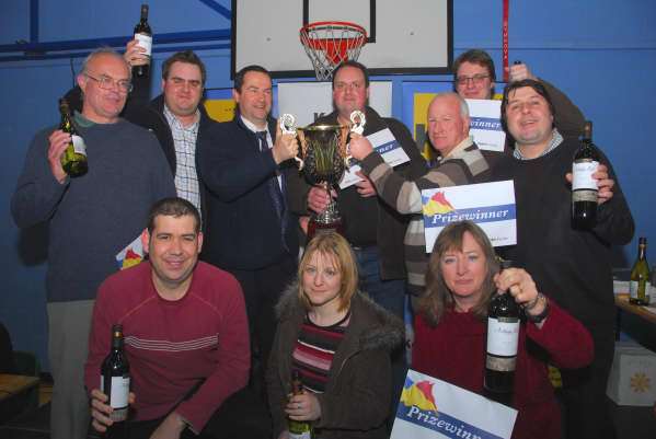 Ted Phillips and the winning team of the 2008 KM Big Quiz, The Unicorn, are presented with the trophy by event sponsors Phil Aust (l), general manager of Bretts, and Chris Sear (r), environmental services manager at Serco.