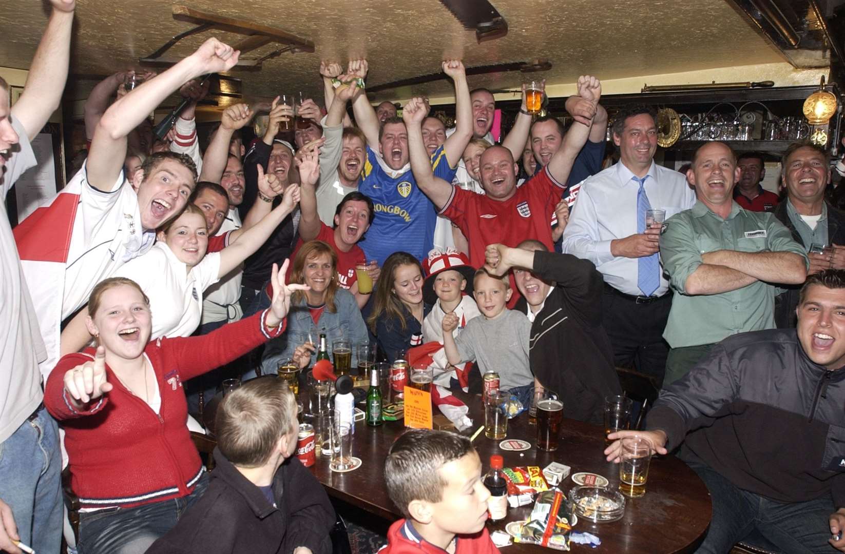 England fans at the Albion pub in Ashford, Willesborough, celebrate their team's victory over Argentina in the 2002 World Cup. Picture: Dave Downey