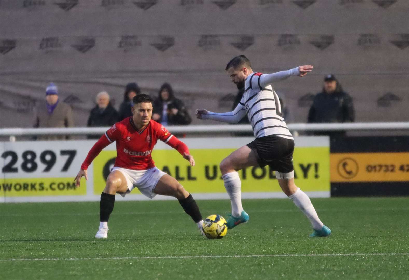 Ben Greenhalgh, of Margate, is closed down by Chatham substitute Jordy Robins. Picture: Max English (@max_ePhotos)