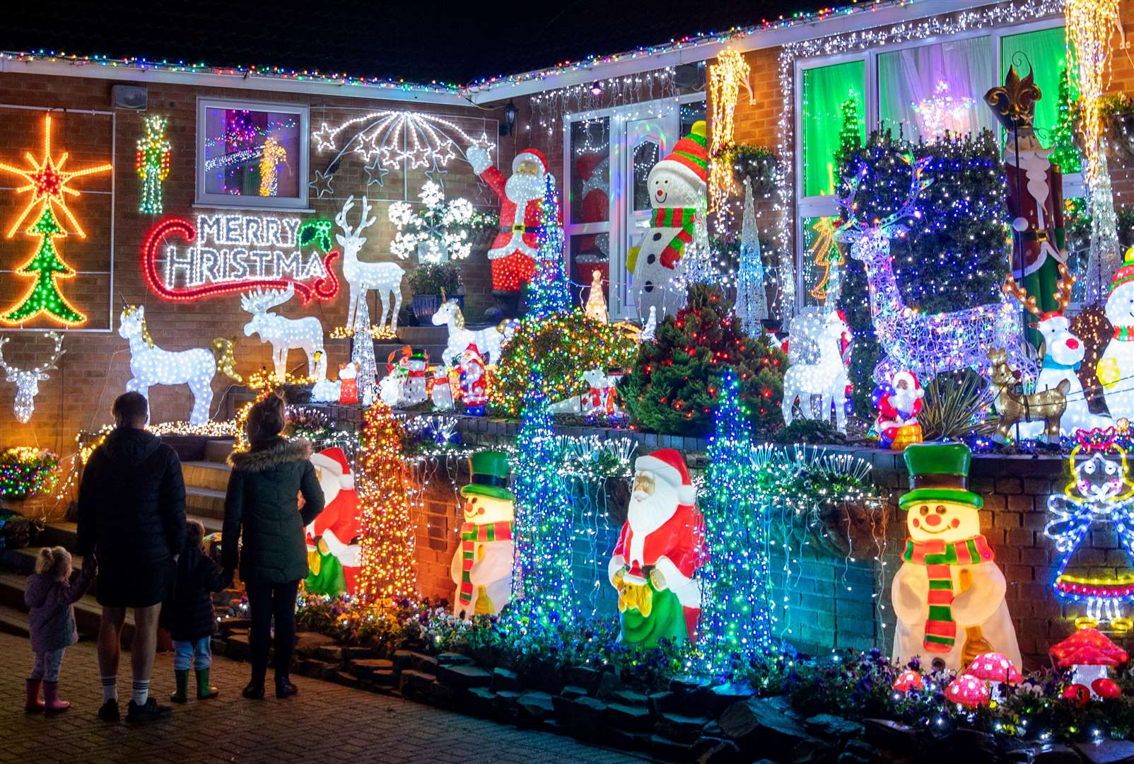 A house in Cambridgeshire decorated with hundreds of Christmas lights to spread a little early Christmas cheer (Joe Giddens/PA)