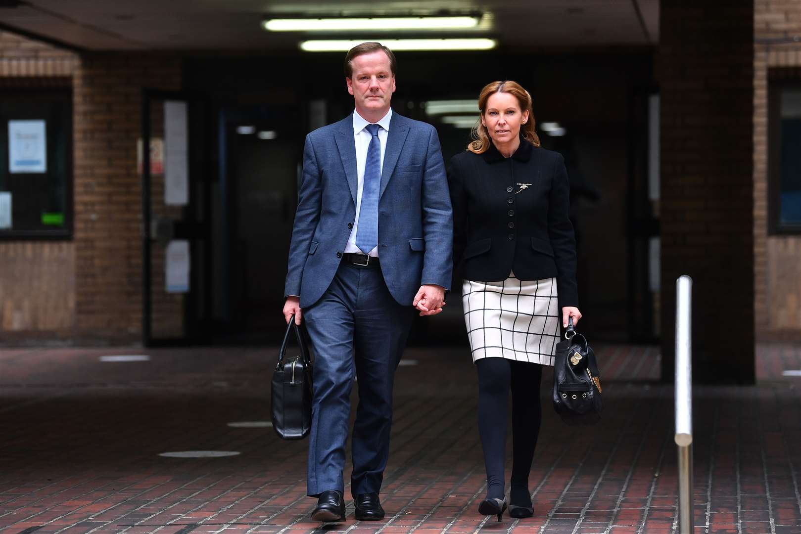 Former Conservative MP Charlie Elphicke, with MP for Dover Natalie Elphicke, leaving Southwark Crown Court (Victoria Jones / PA)