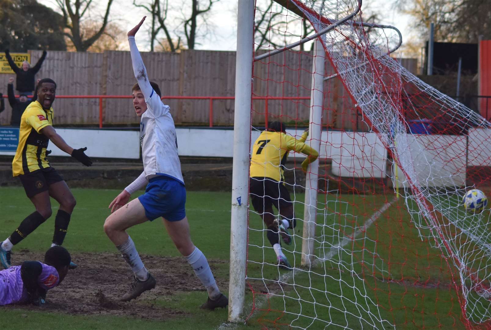 Gil Carvalho (No.7) wheels away after scoring Herne Bay's injury-time equaliser at Erith & Belvedere Picture: Alan Coomes