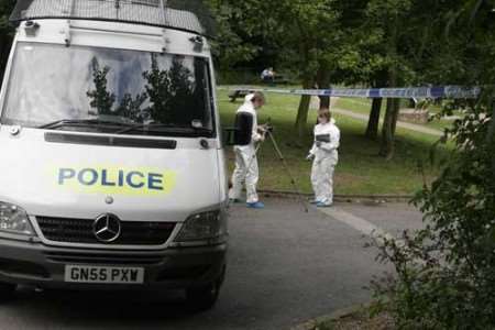 A forensic team hunts for clues in Capstone Farm Country Park. Picture: PETER STILL