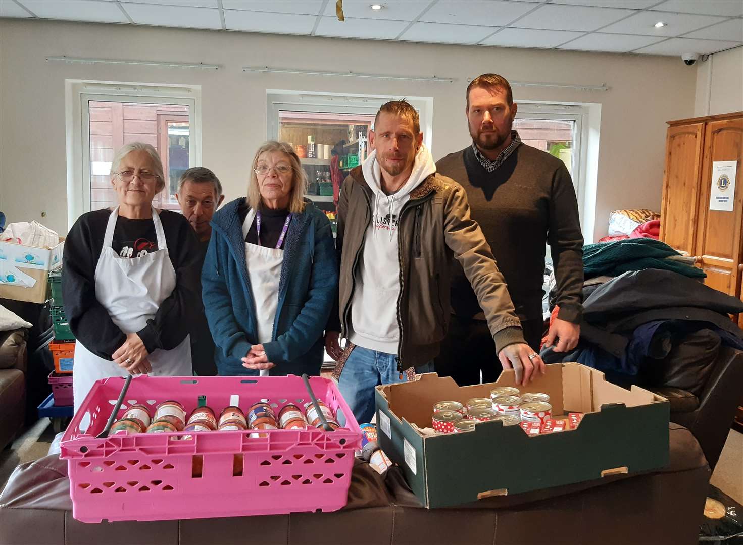 Richard O'Neill (front right), with Maidstone Day Centre manager Matt Lamb (back right), and other employees and volunteers